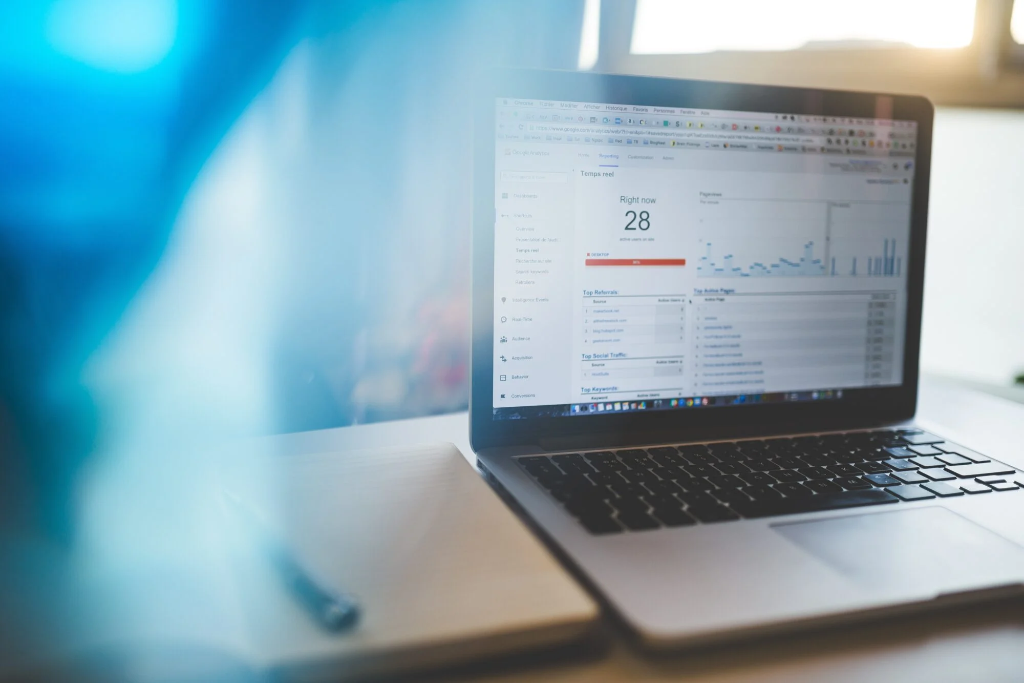 A macbook with the internet opened viewing Google Analytics. 