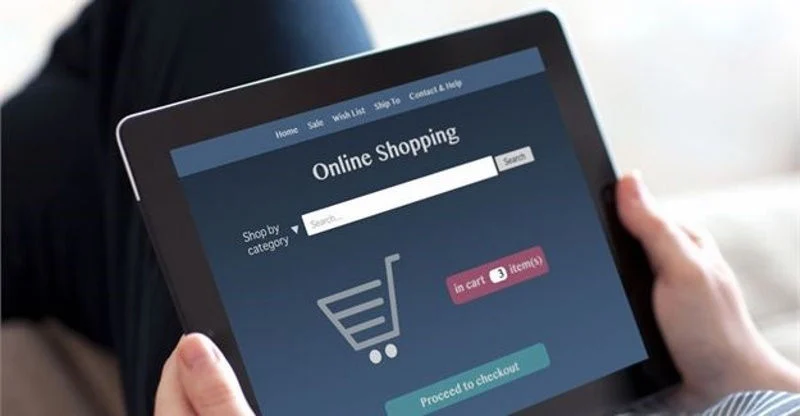 A person on their iPad reviewing an online store.