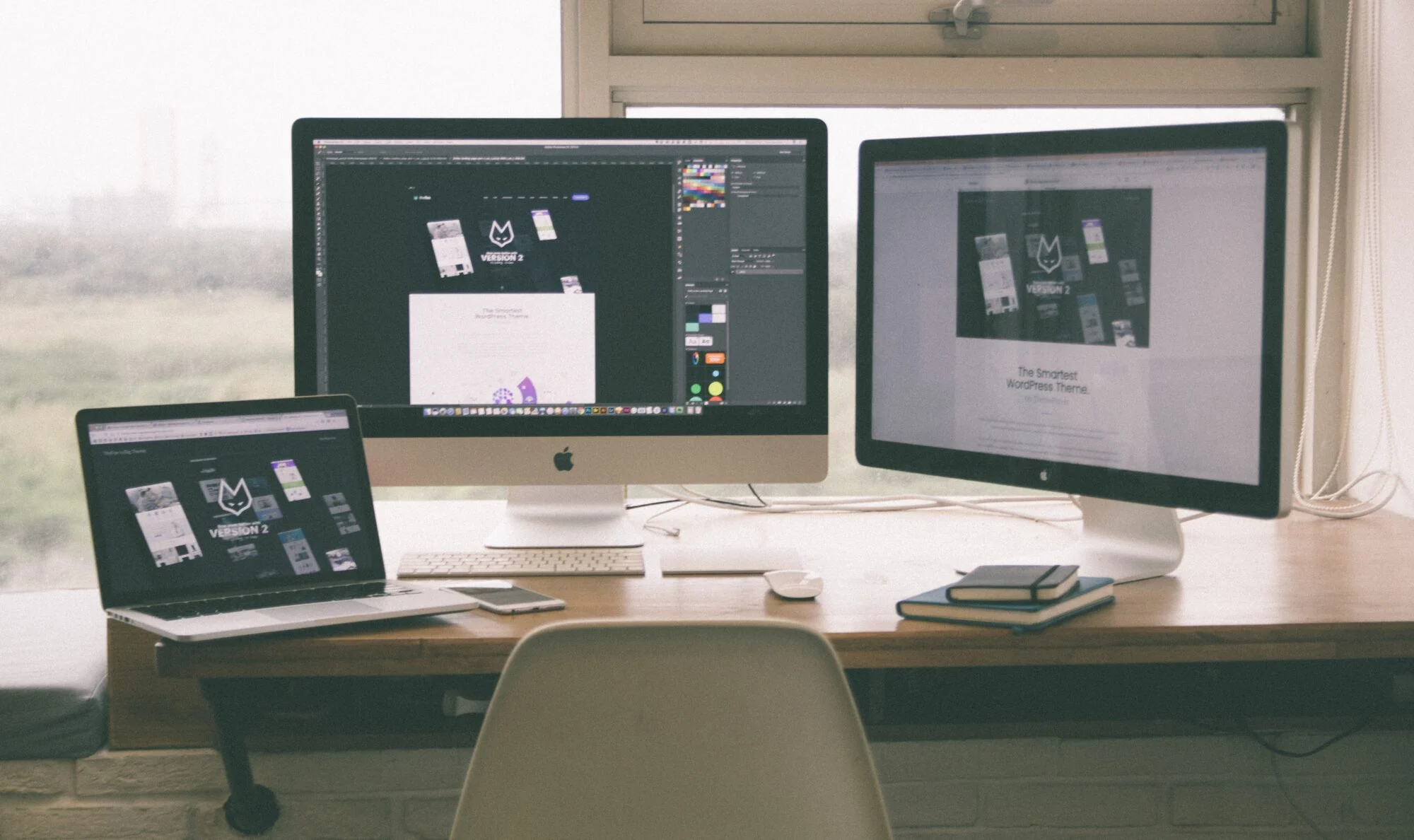 A selection of Apple computers with logo designs featured on photoshop
