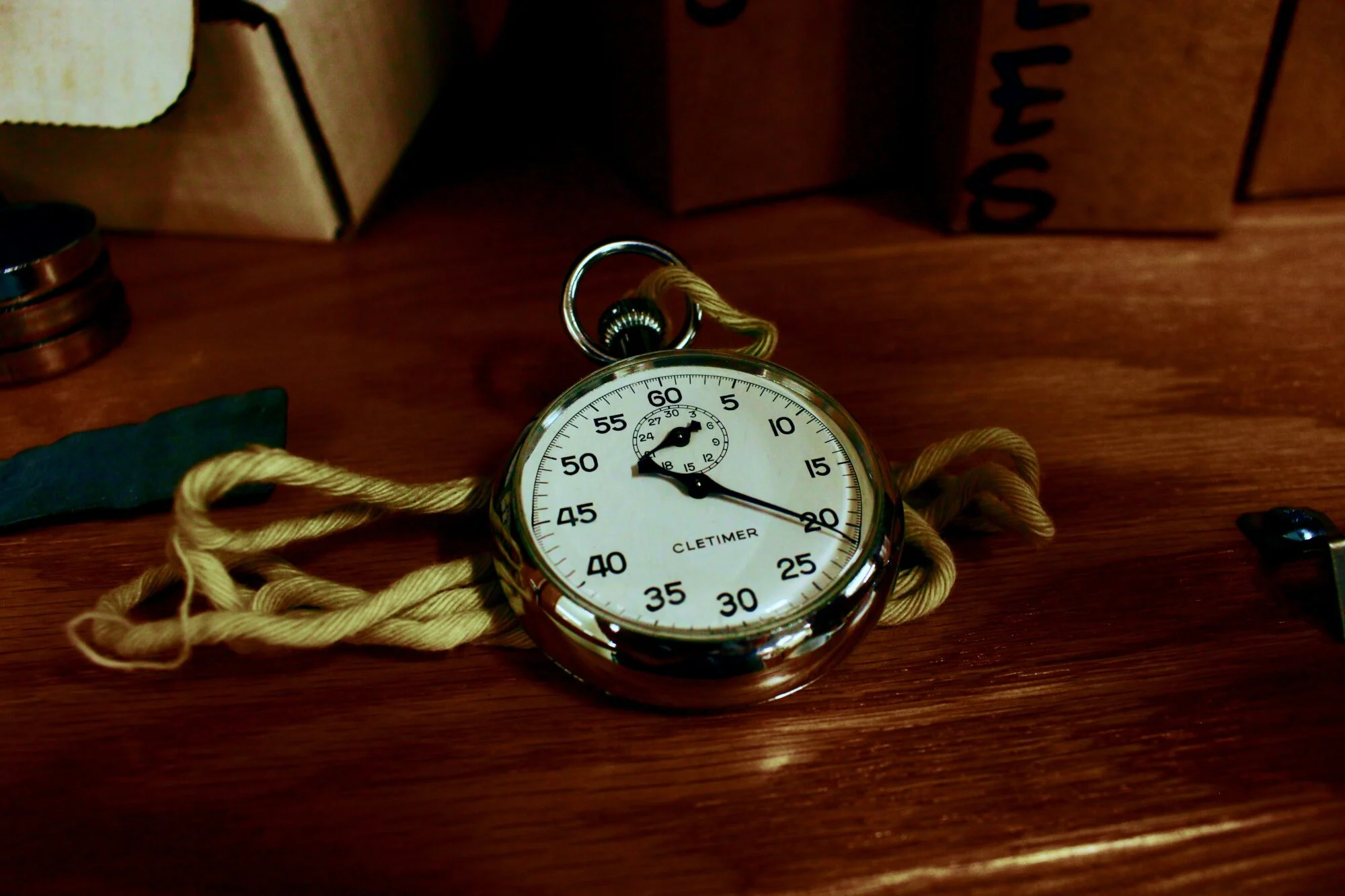 An image of a stopwatch resting on a table.
