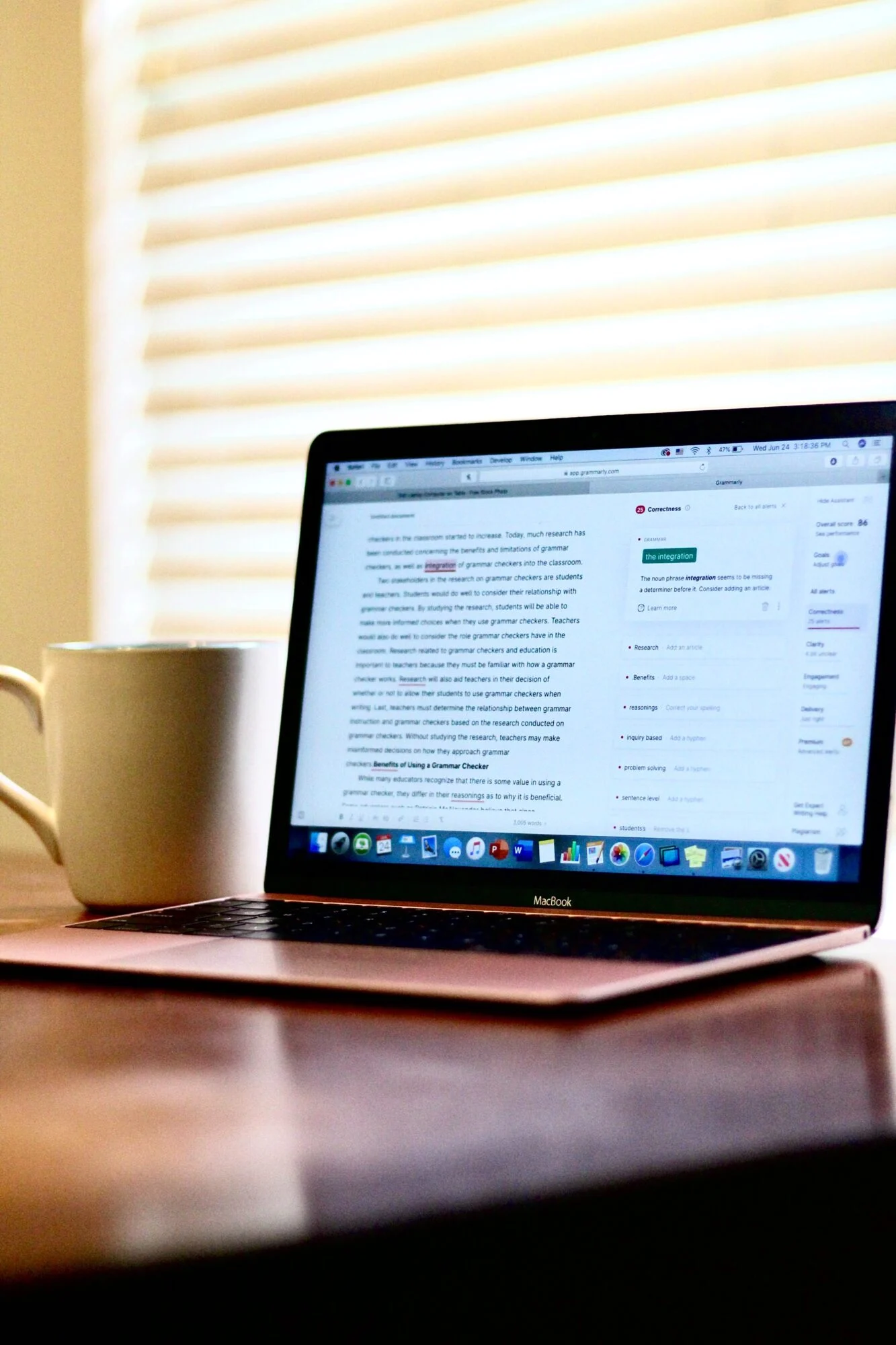 A mac with Grammarly open to check a documents punctuation and grammar.