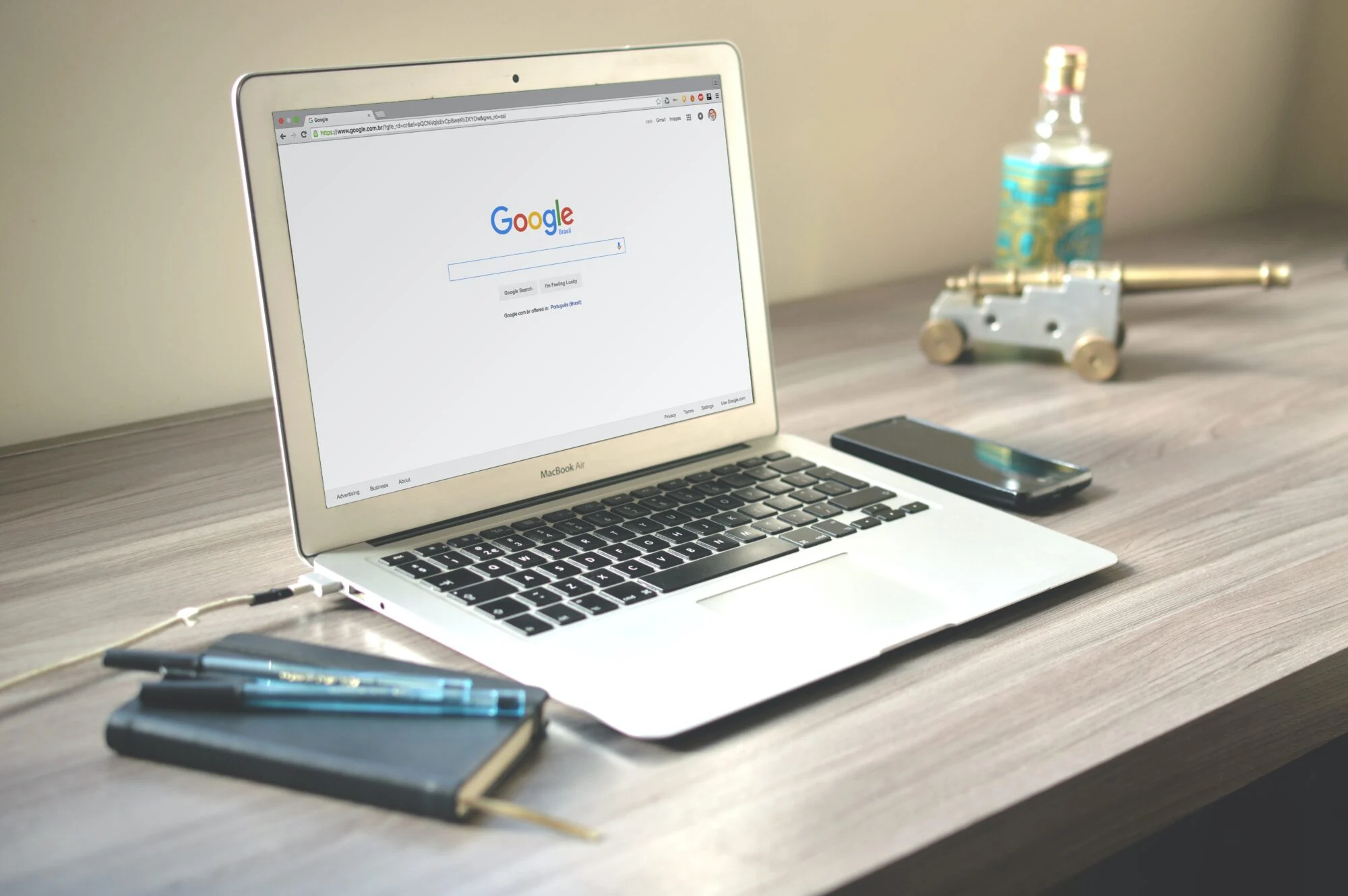 An open laptop displaying the Google website. 