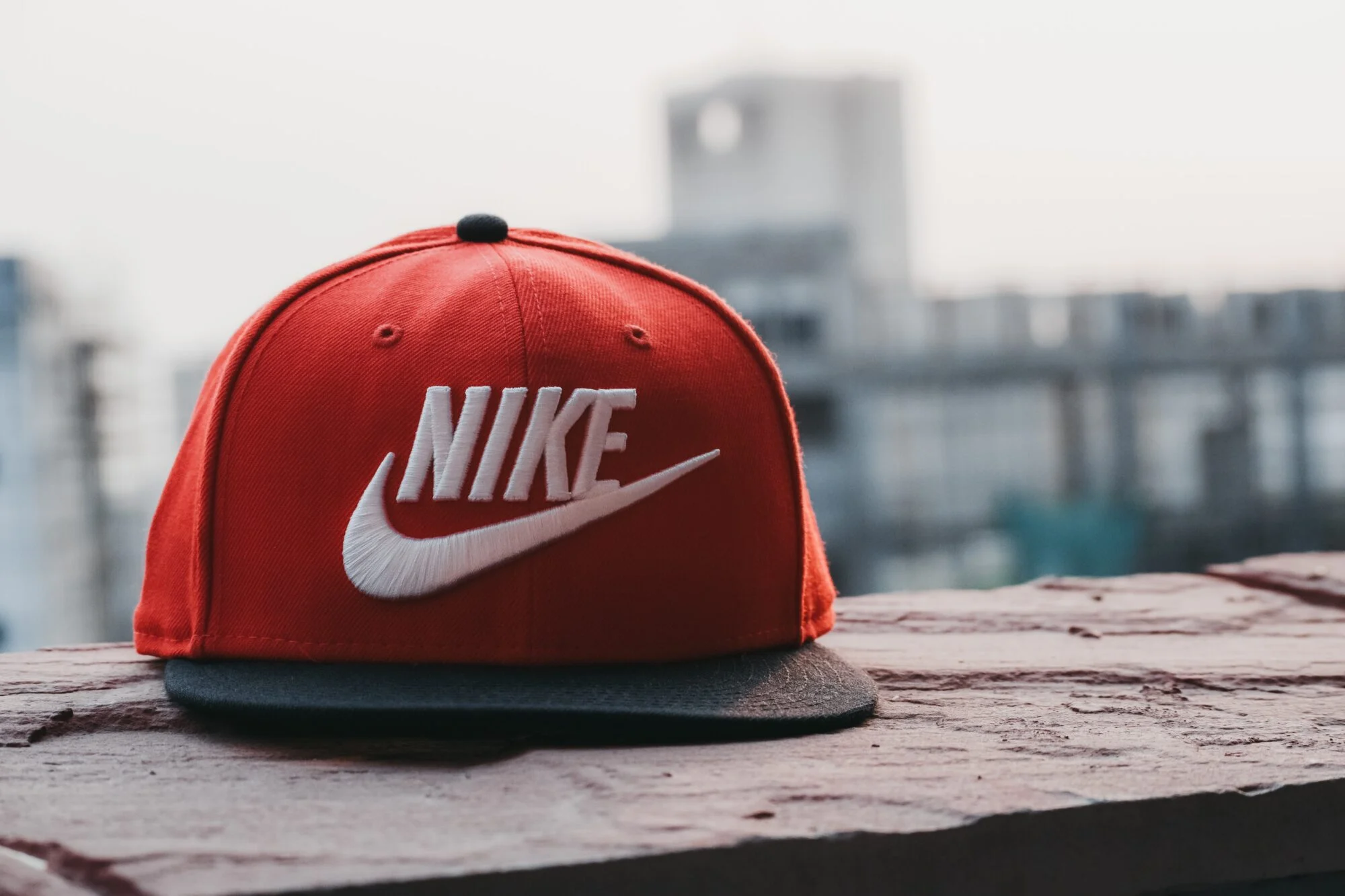 A red nike cap with the logo in white text