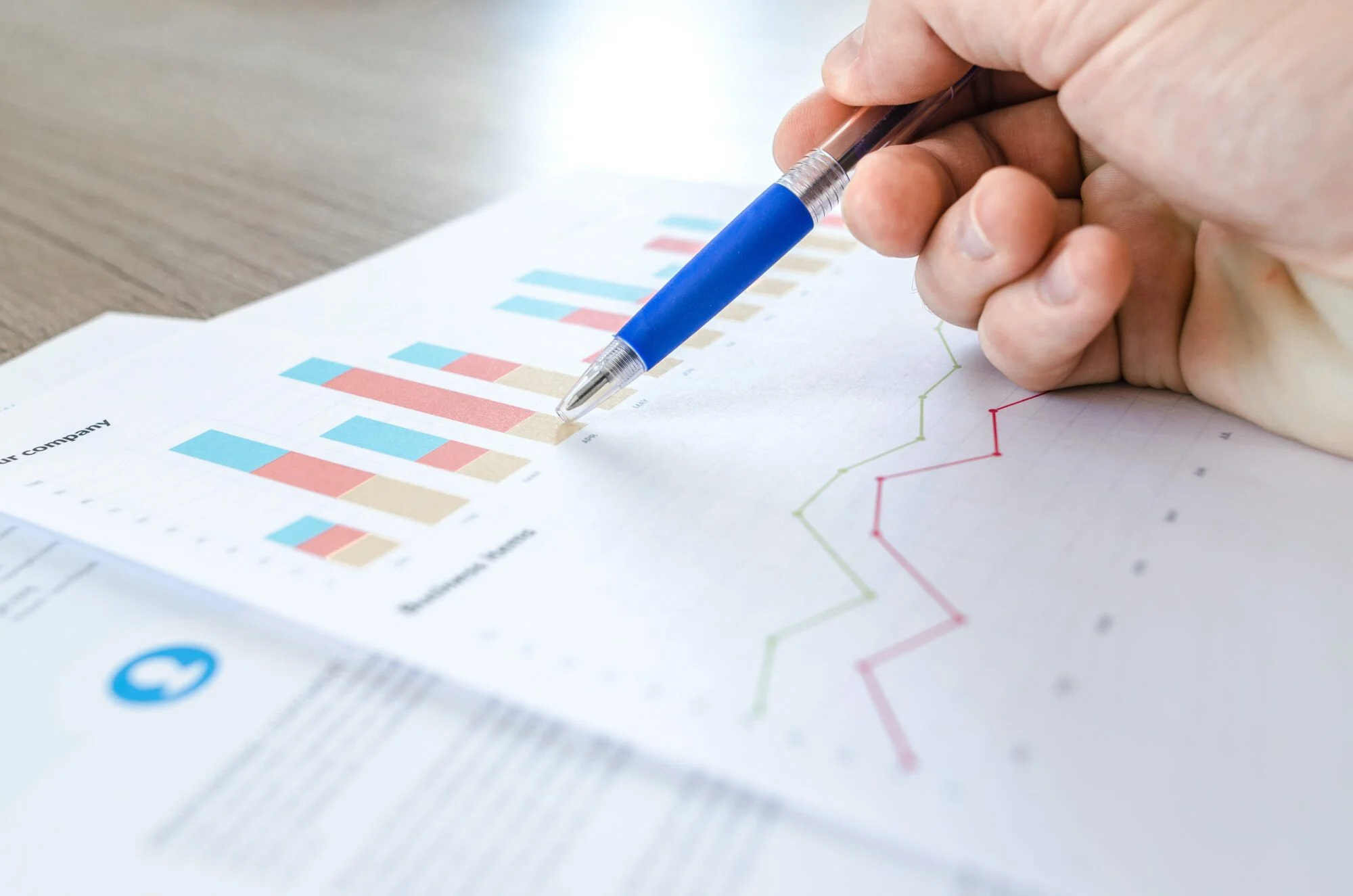 A person reading over statistics on a piece of paper