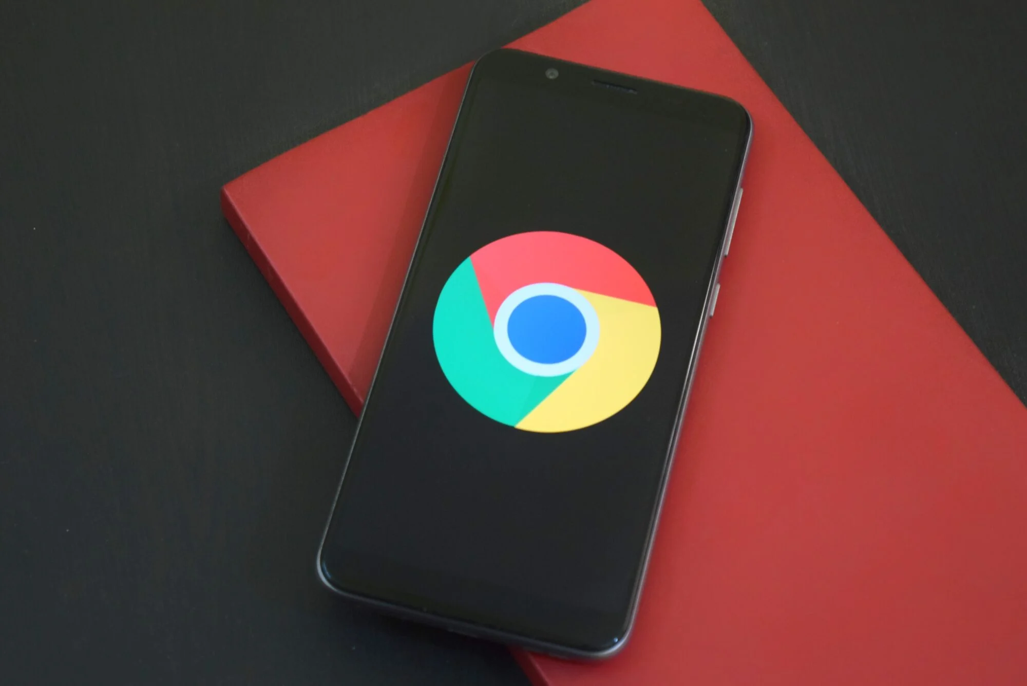 The google Chrome logo displayed on an iPhone.