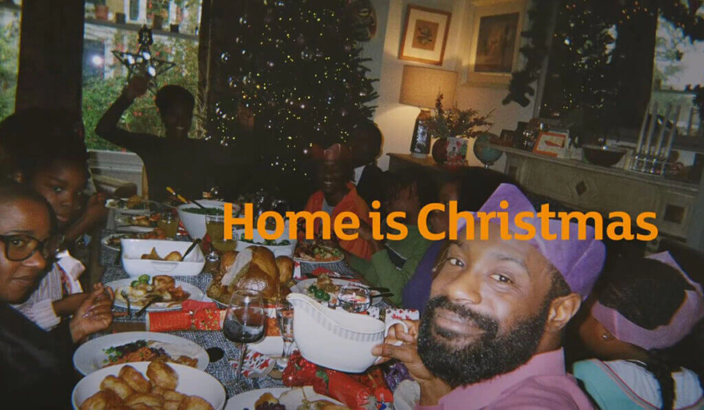 Family Christmas dinner with the caption Home is Christmas from Sainsbury's advert