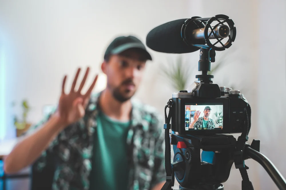 A behind the scenes shot of an influencer recording a video for an affiliate marketing team.