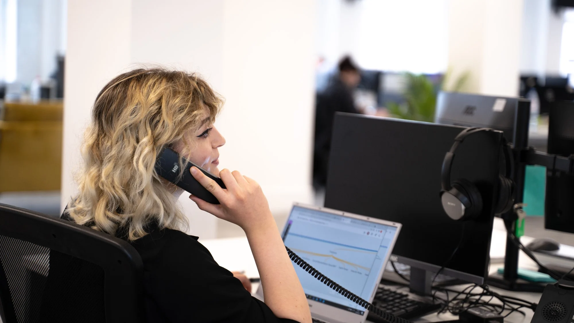 Castle's head of SEO, Rachel Walton on the phone to a client giving them a report on what is bounce rate in SEO.