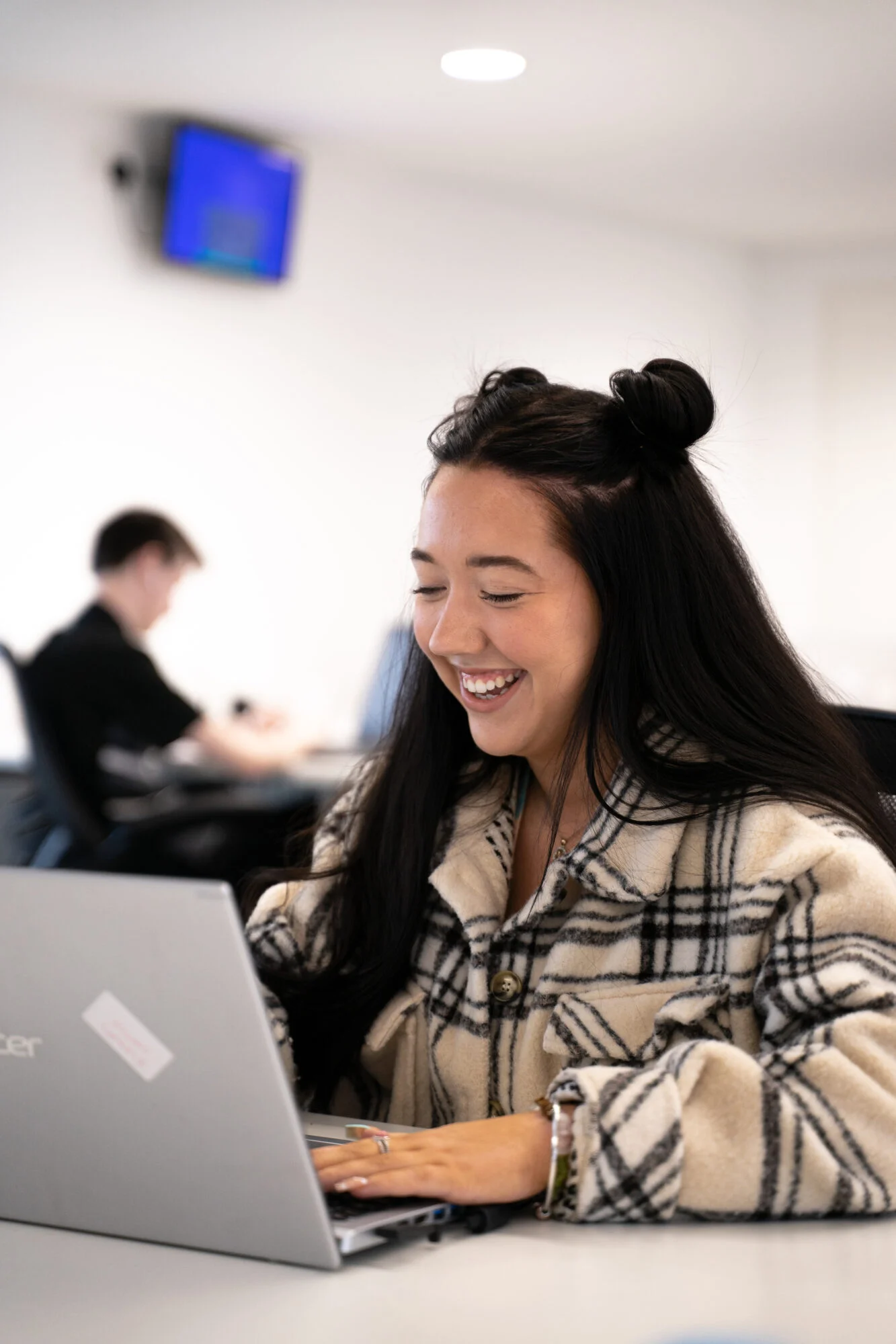 The Head of Social at Castle, Elena Rosewell on her laptop during a zoom call explaining to a client her strategy on how to grow your Instagram account.