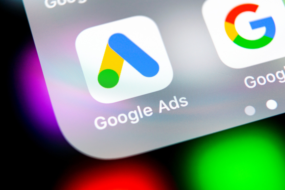 A screenshot of the Google Ads app on an iPhone, next to the Google app.