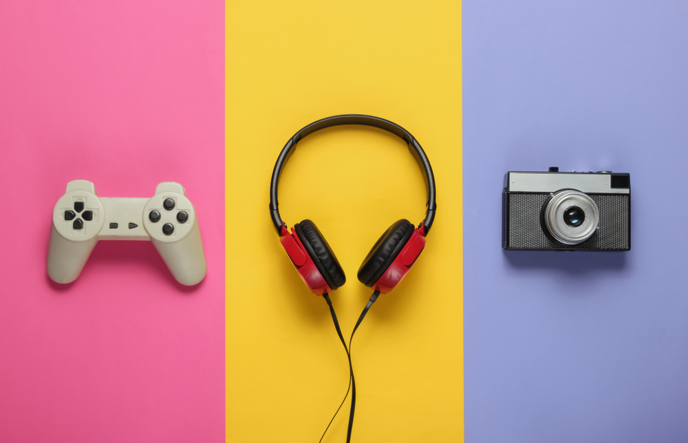 Pop culture attributes in the form of a video game controller, a pair of headphones and a camera to showcase the importance of pop culture in marketing.