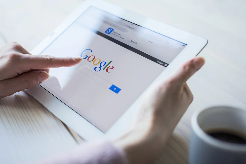 The Google website displayed on an iPad looking for related questions.