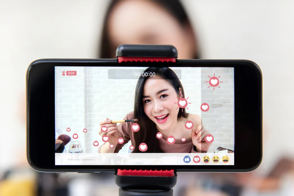 An influencer recording a video to showcase how to find influencers for affiliate marketing