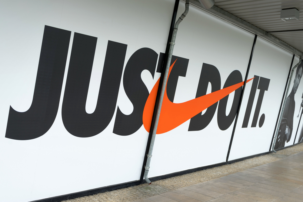 An orange Nike logo with the tagline of "just do it" to demonstrate the effectiveness of simplistic design for marketing. 