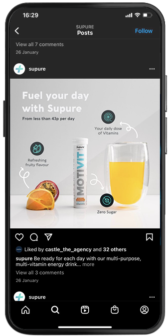 Smartphone showing a Supure Instagram post promoting a multivitamin energy drink
