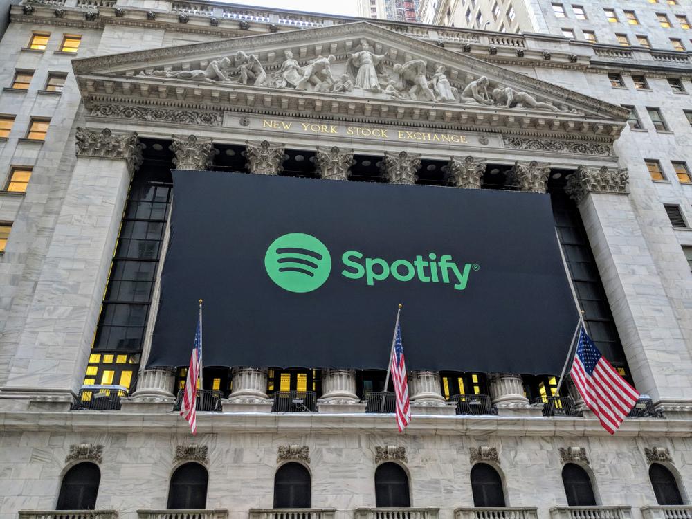 A Spotify banner outside the New York Stock Exchange, celebrating the company venture into public trading.