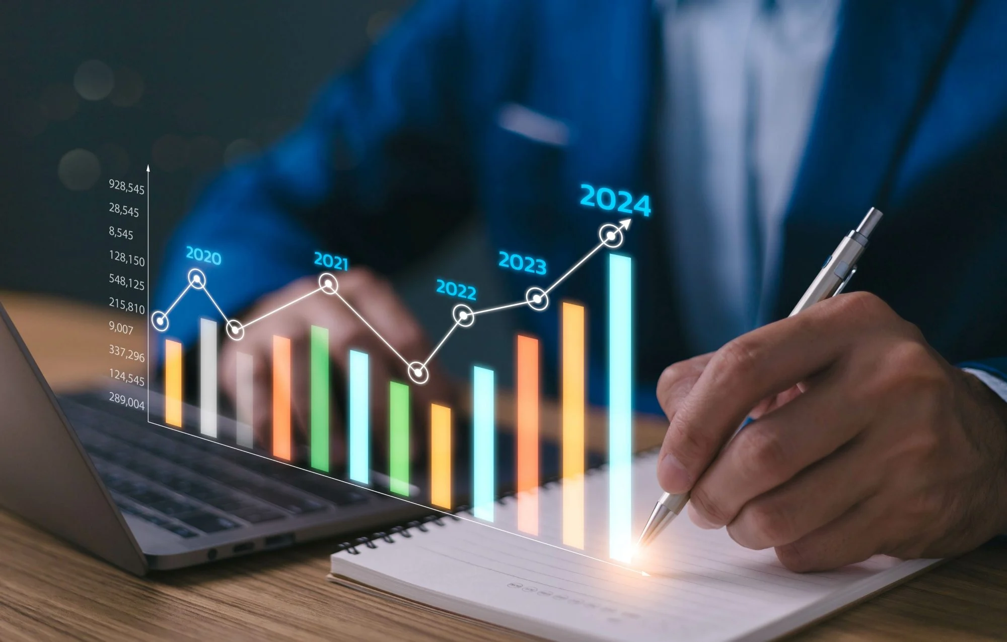 Marketer writing in a notebook as a holographic chart shows sales growth from 2020 to 2024