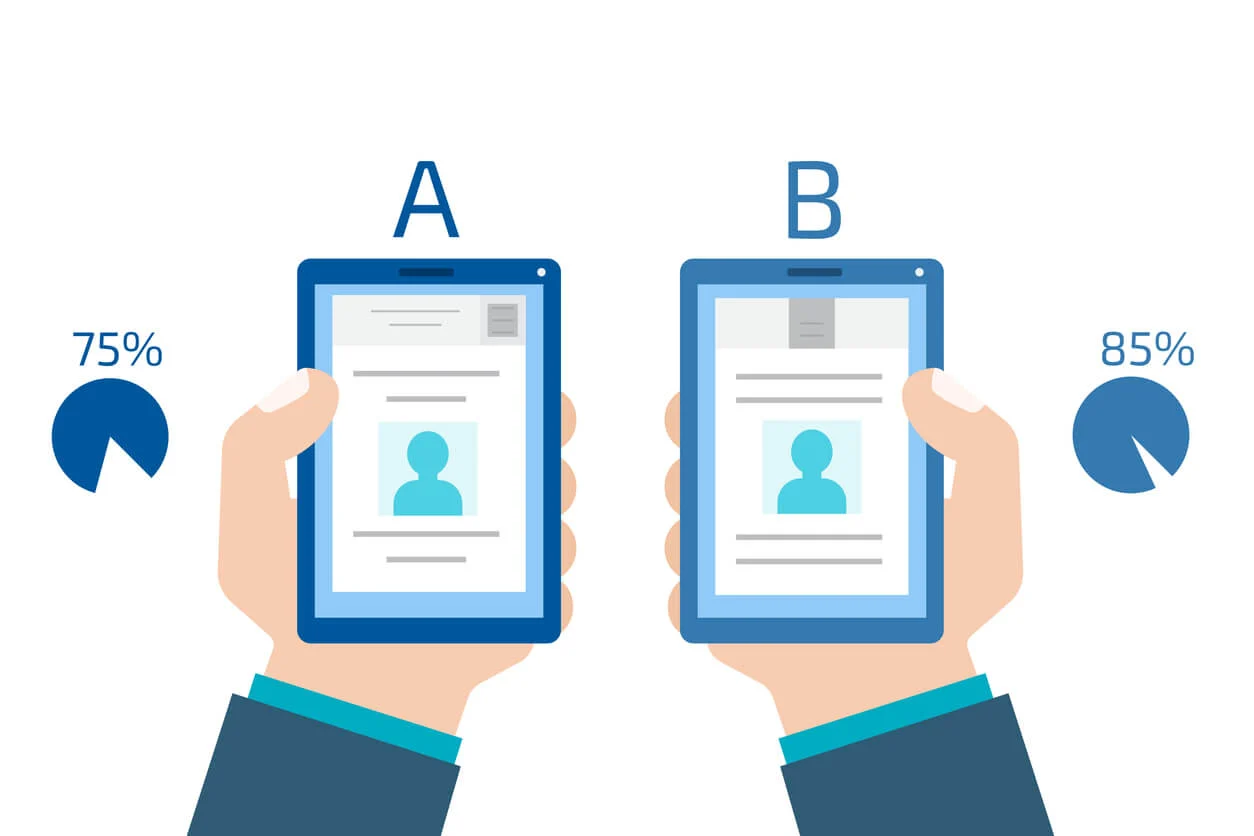 A/B test concept image. A graphic of two cartoon hands holding phones, the one of the left has 'A' above it and a pie chart with 75% coloured in, and on the right it says 'B' above it and with a pie chart next to it with 85% coloured in. 
