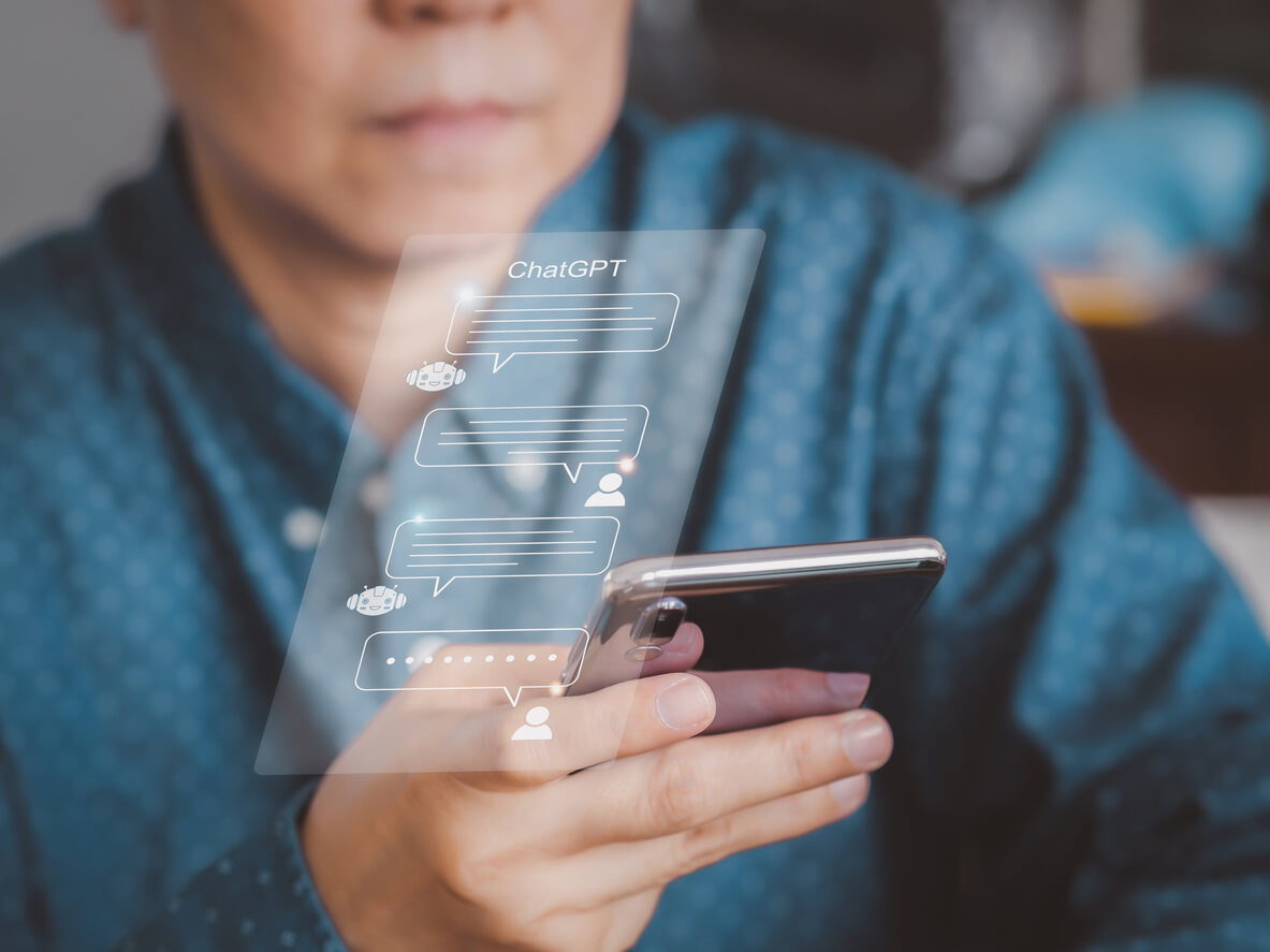 Businessman using ChatGPT digital ai chatbot, on smartphone. A.I., system artificial intelligence on virtual screen.