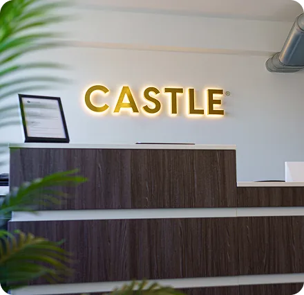 The Castle International office reception with illuminated Castle signage