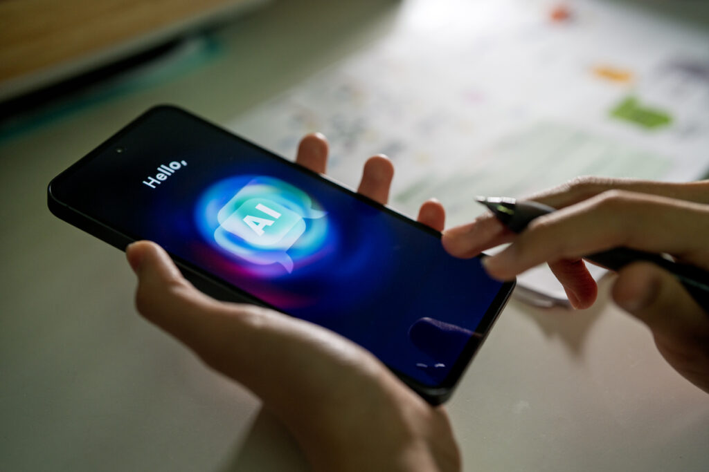 Person using an AI chatbot app on a smartphone, interacting with an artificial intelligence assistant for mobile communication and productivity tasks.